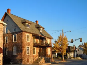 A stone building and street corner in Souderton Borough.